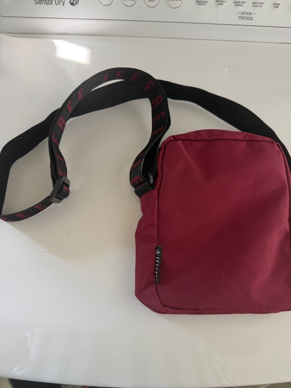 Jeffree Star Burgundy Crossbody Bag with Black Strap